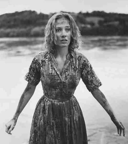 Candace Hilligoss covered in mud