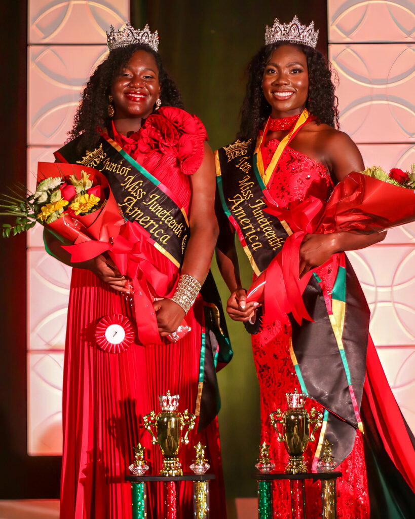 Photo of two newly crowned African American beauty pageant winners smiling