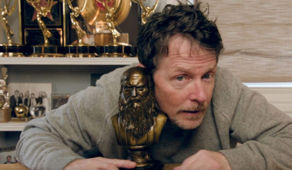 Photo of actor Michael J. Fox holding the DaVinci Film Festival Visionary Award
